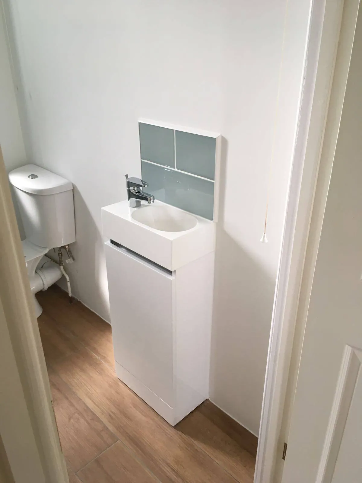 A bathroom with a sink and a toilet.